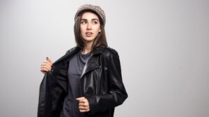 Model wearing a stylish red vegan leather jacket, highlighting affordable and ethical leather alternatives.