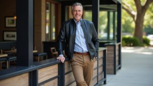 Smart-casual leather jacket outfits for men with a button-down and chinos.